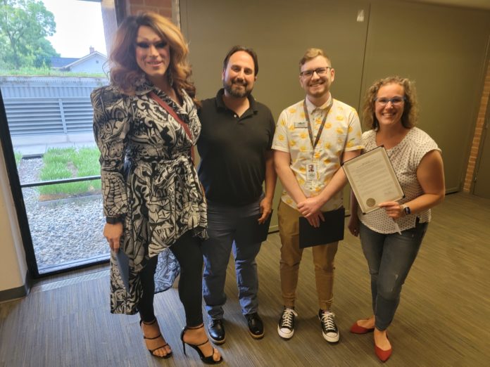 Jaedin Black, furthest left; Joe Halsch, President of the Jim Toy Center, center-left; Sean Reynolds, center-right; and Naomi Goldberg, furthers left; moments after Taylor made his declaration on June 5.