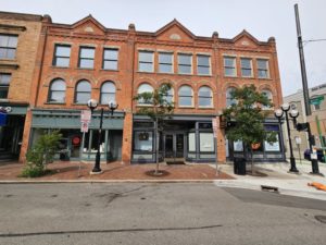 Picture of a orange stone building.