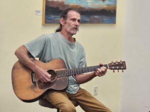 Dick Siegel performing with a guitar he has entertained Ann Arbor with for decades. 