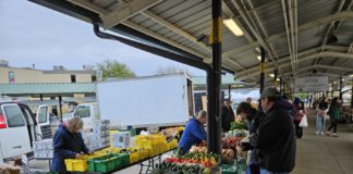 Patrons visiting the farmer's market recently. Photo by Drew Saunders.