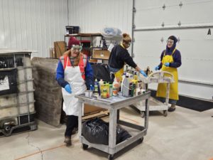 Staff sorting delivered hazardous waste. Photo by Drew Saunders.