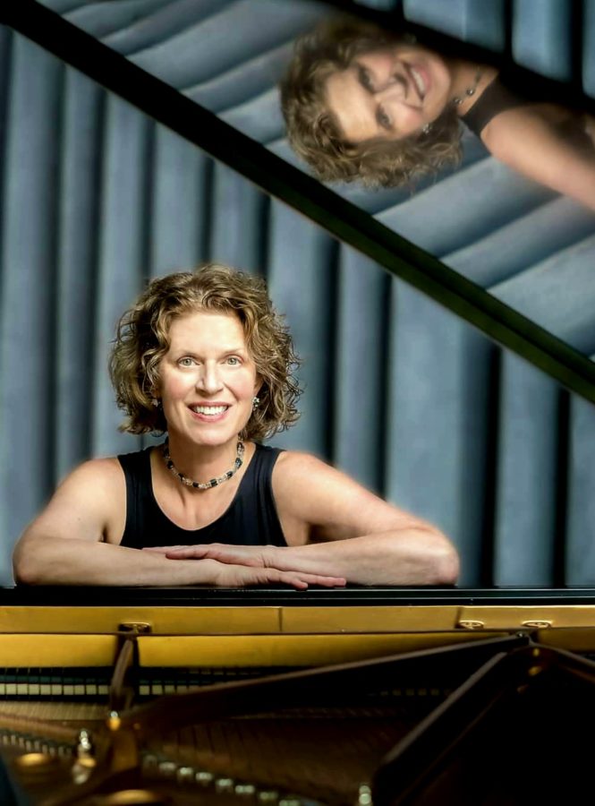 A photo of a person posing for a picture.