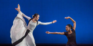 Actors performing on stage.