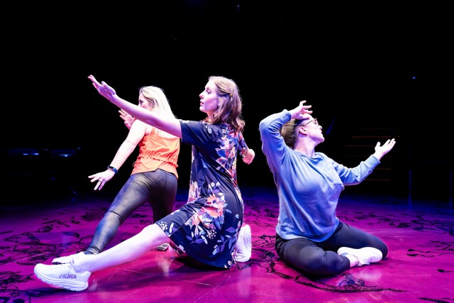 A group of actors performing on stage.