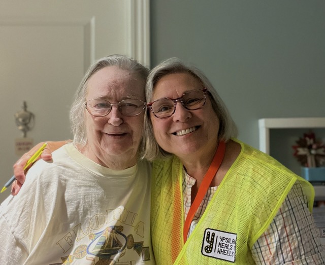 Two people smiling for a picture/