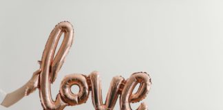 A Photo of a balloon spelling out "love"