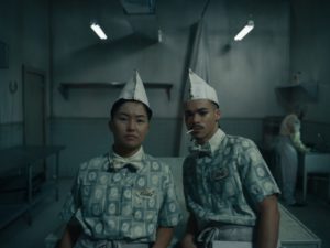 A photo of 2 people in work outfits.