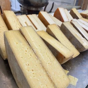 A assortment of sliced cheese.