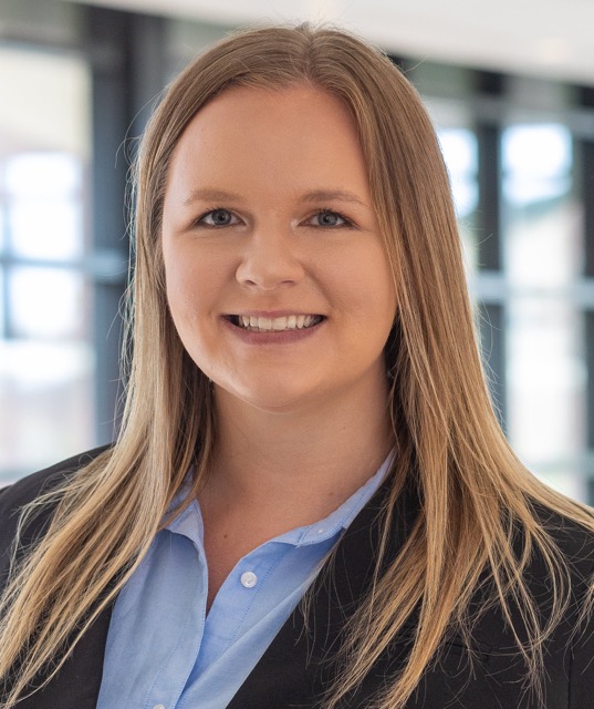 A person smiling for a picture.