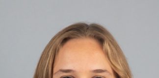 A professional portrait of a person.