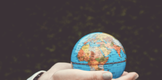 A person holding a glob in their hands.