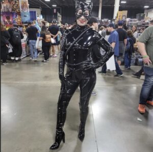 A person dressed up for comic con.