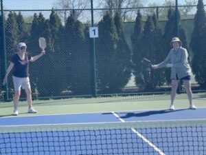 Two people playing pickleball.