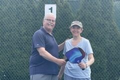 Two people playing pickleball.