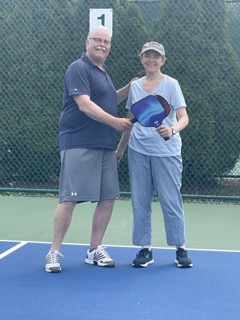 Two people playing pickleball.