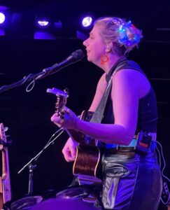 Lead singer playing guitar