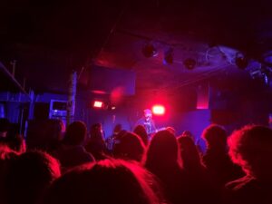 Lighted stage with band playing music