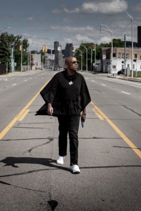 A photo of a person walking down the street.