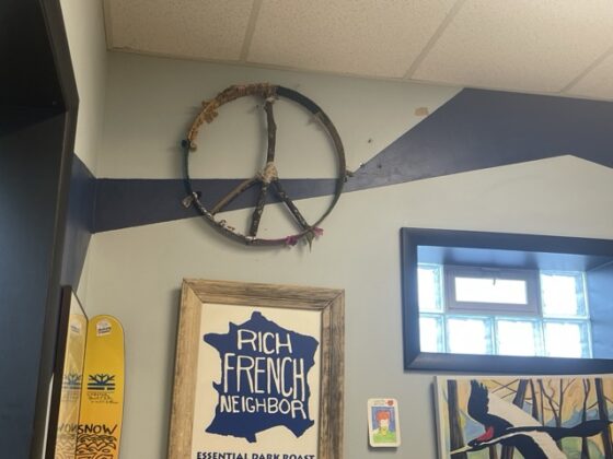 A coffee shop with lots of decoration on the walls.