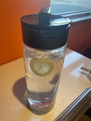 A container of lemon water.