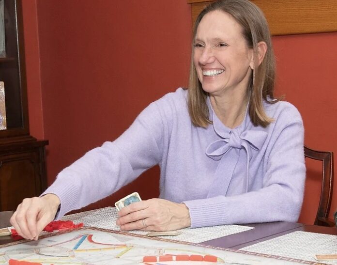 Woman sitting at table smiling