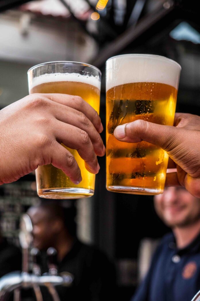hands holding beer