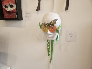 Colorful mask against white wall