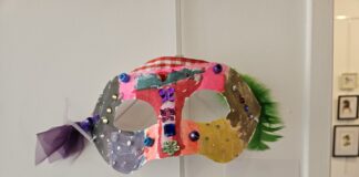 Colorful mask against white wall