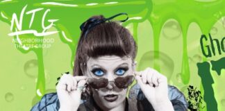 Woman with sunglasses and green background