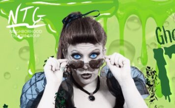 Woman with sunglasses and green background
