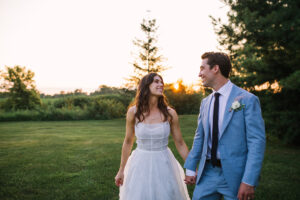 Bride and groom walking and smiling