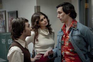 Two men and a woman talking