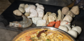 Bowl of hot pot with noodles and shrimp