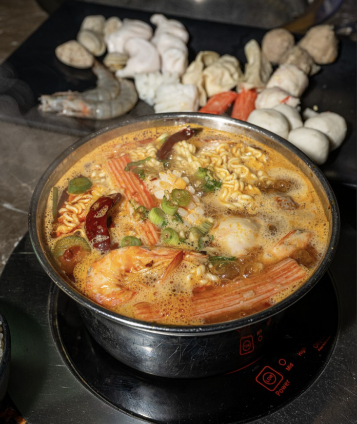 Bowl of hot pot with noodles and shrimp