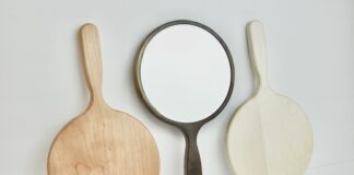 Three wood and glass hand mirrors