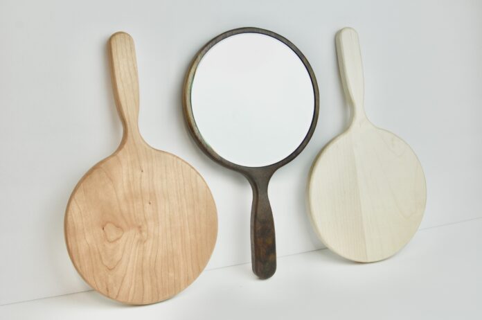 Three wood and glass hand mirrors