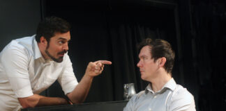 two performers on stage