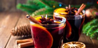 Mulled wine on table by spices