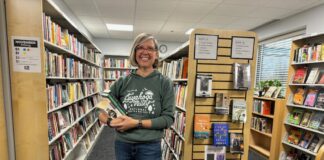Women in bookstore posing and smiling