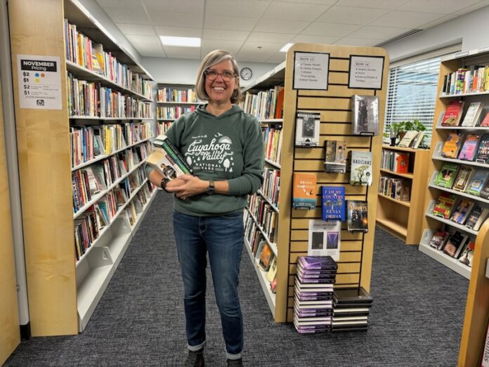 Women in bookstore posing and smiling