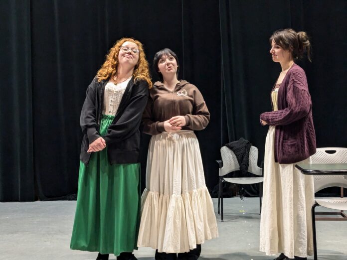 Three actors on stage