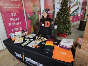 Table outside with person behind it