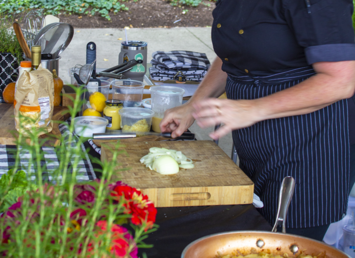 Person cooking on cutting board