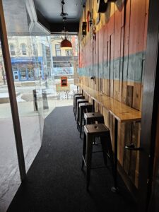 The new seating bench at the front of the new location. Photo by Drew Saunders.