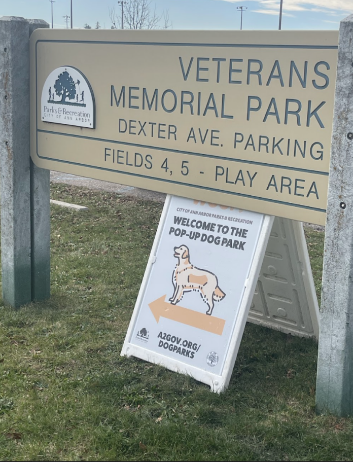 Dog park sign by park sign