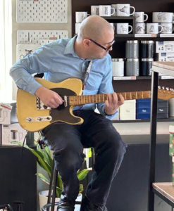 Man playing guitar sitting