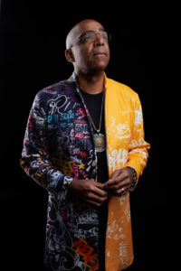 Photo of man in colorful jacket