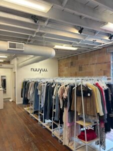 Photo of interior of vintage store with clothing racks