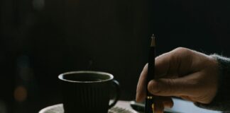 writer with coffee and pen