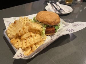 A smash burger and waffle fries.